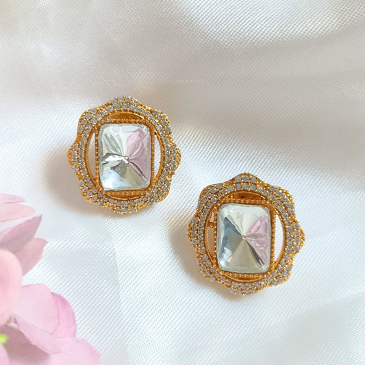 Uncut kundan square shaped gold toned surrounded by small white stone earrring