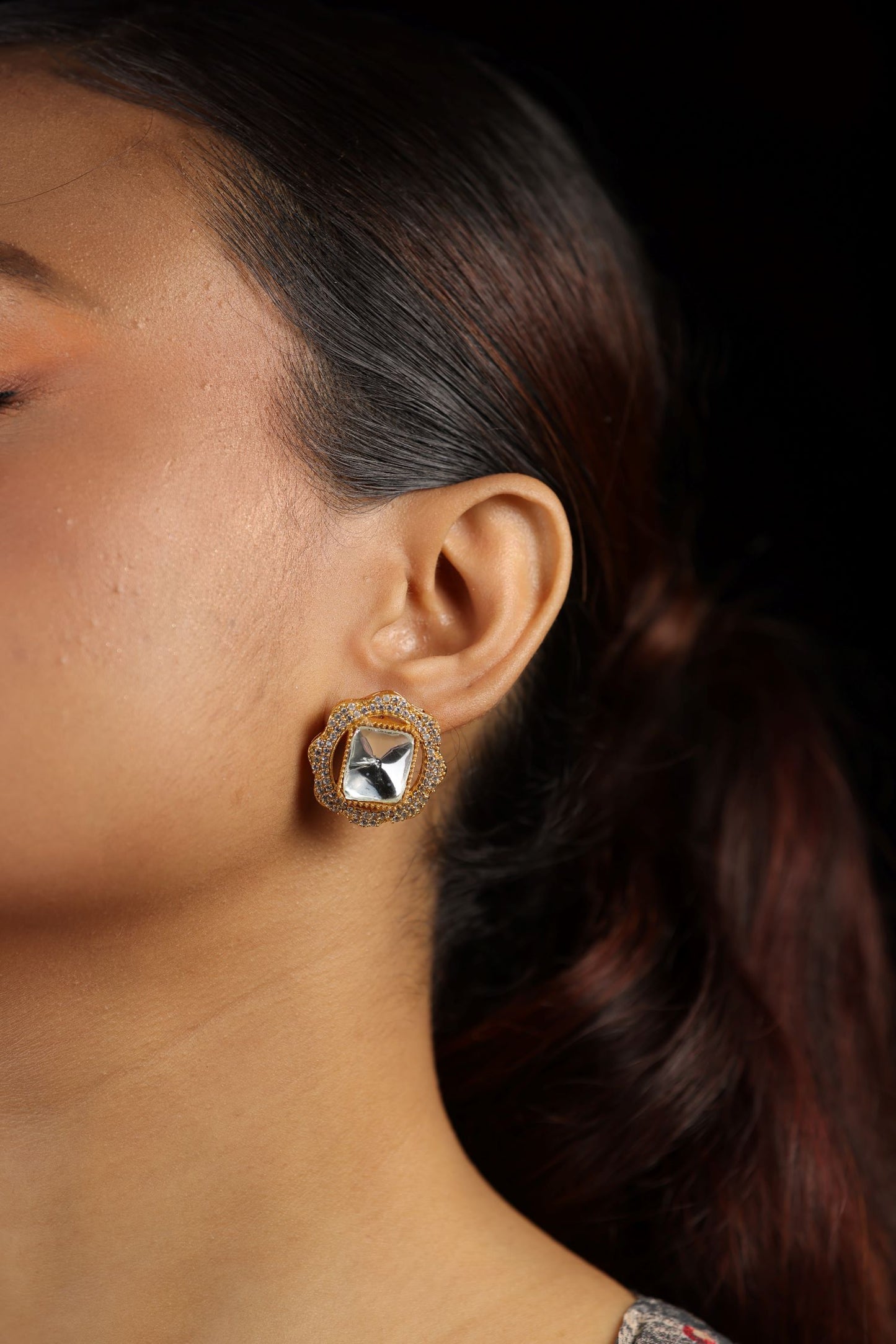 Uncut kundan square shaped gold toned surrounded by small white stone earrring