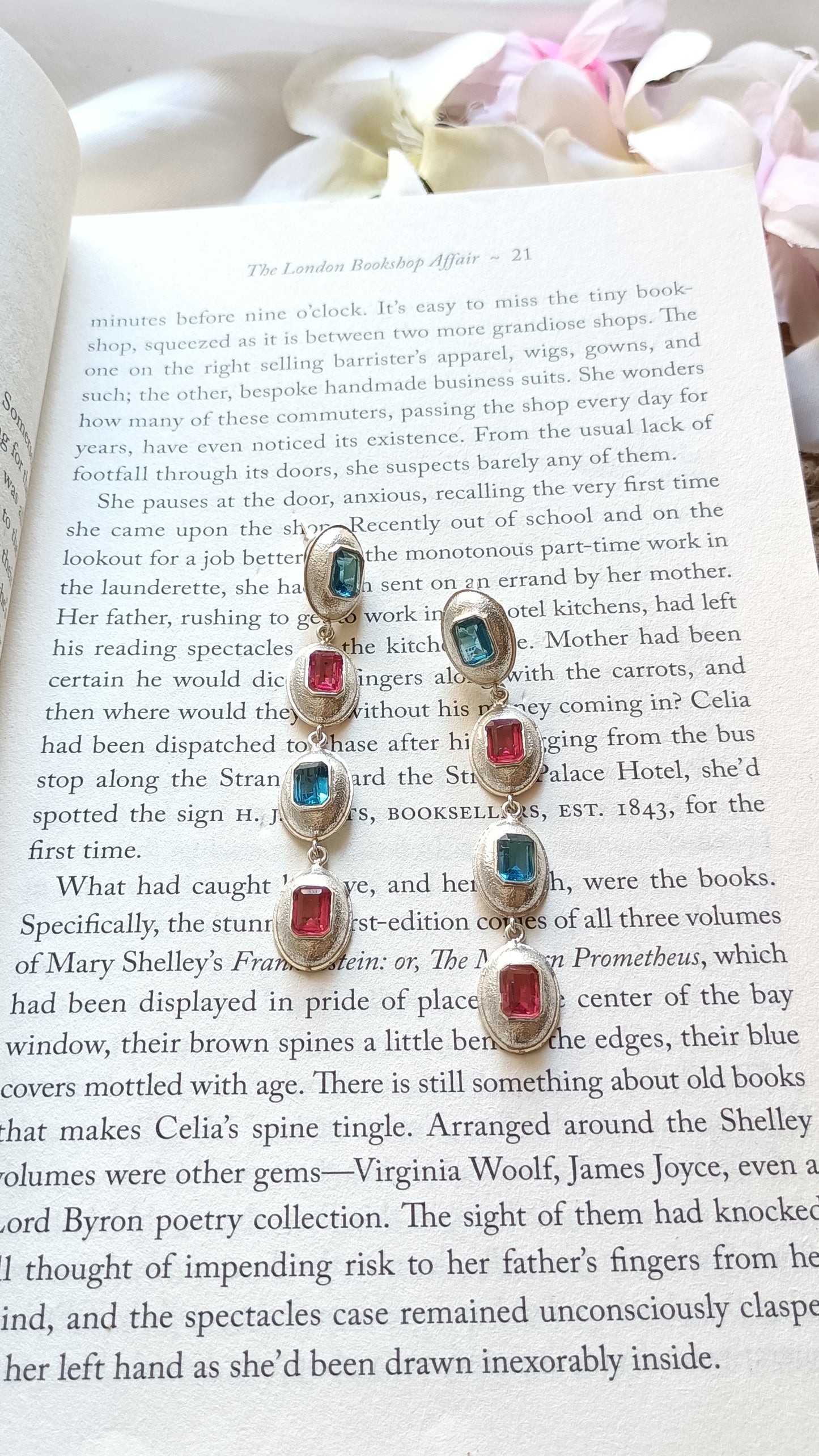 Linear design four bezel-set with oval shaped gemstones dangling earring