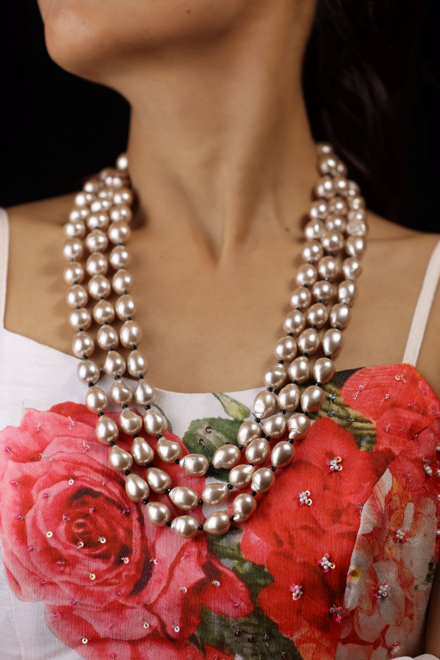 Vintage-style neckpiece with three strands of lustrous, baroque rose gold pearls