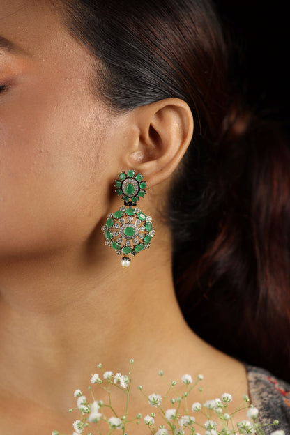 Green gemstone dangler style earring