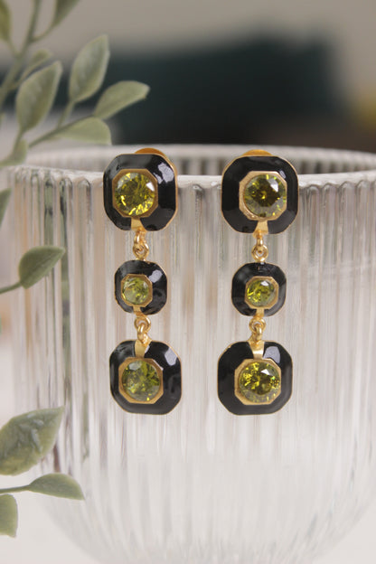 Dangling design earring with three bezel set square shaped gemstones